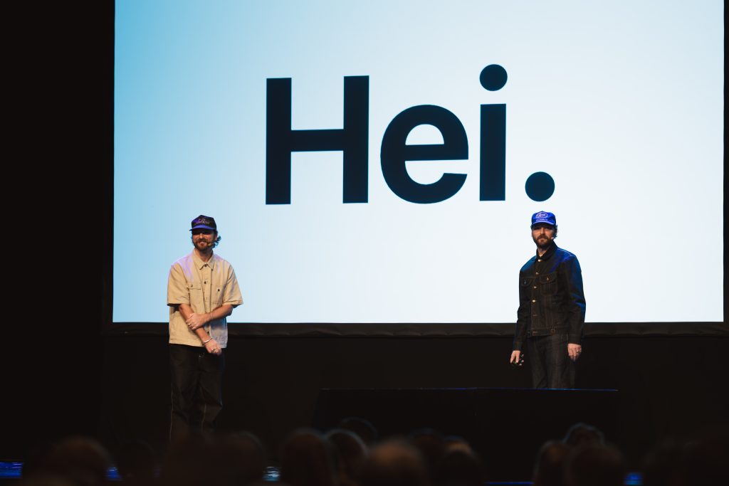 George and Tom McQueen on stage at Grand One AI Day 2025